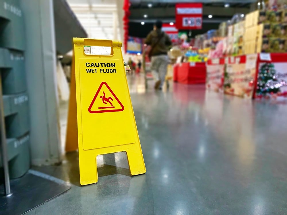 Warning sign caution wet floor at a store