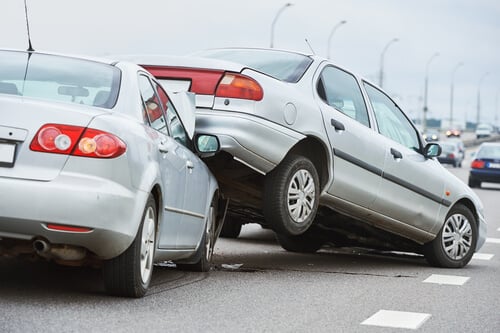 speeding accident with one car hitting another from behind