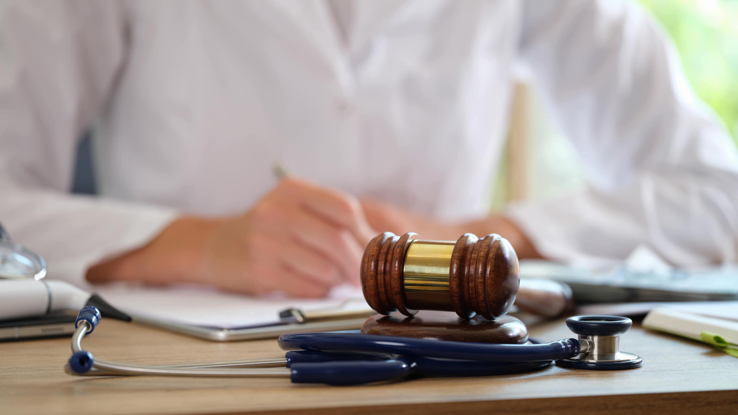 Lawyer Writing On A Paper