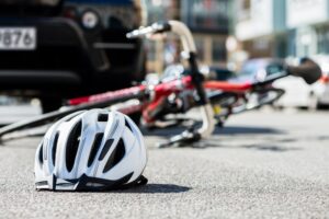 A Cyclist Helmet On The Ground