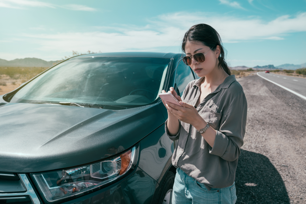 Person Making A Call By Her Car
