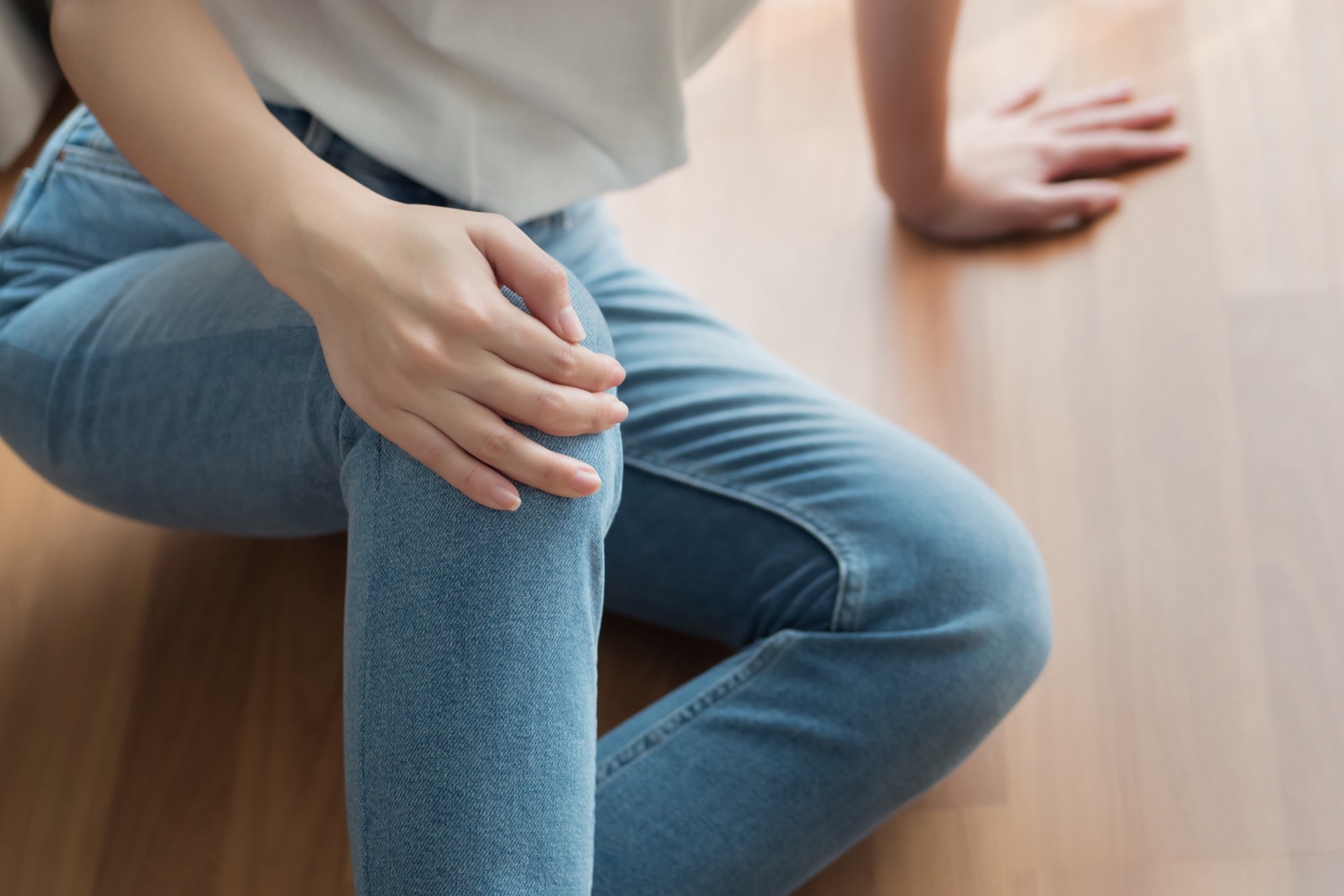 Person Holding Their Knee After Slipping Falling